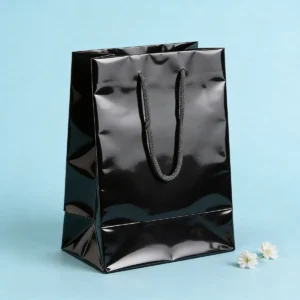 Bolsa papel plastificado negro 22x30cm bautizo