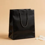 Bolsa papel plastificado negro 22x30cm de comunión